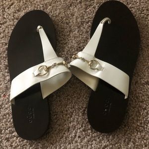 White Gucci sandals...